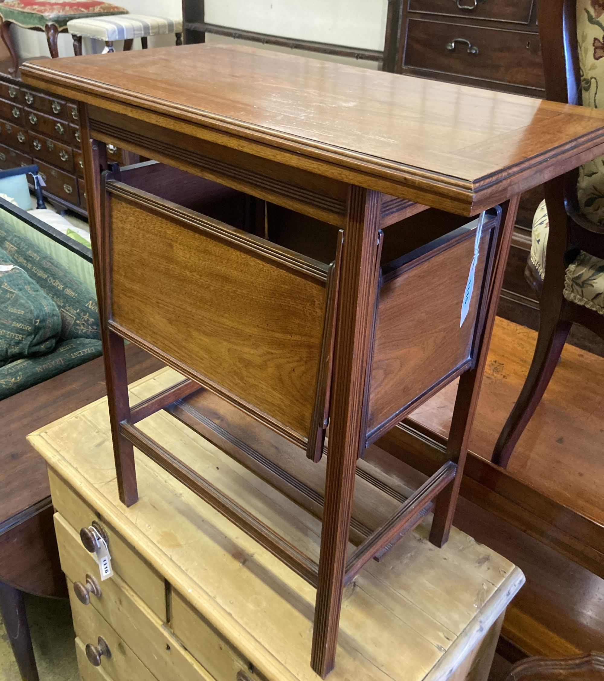 A late Victorian aesthetic movement walnut folding card table, with hinged undertiers, width 71cm, depth 38cm, height 75cm